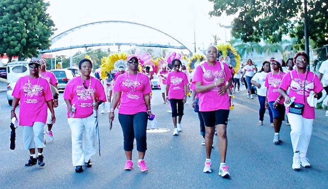 Cancer survivors lead the march down Veterans Drive Sunday.