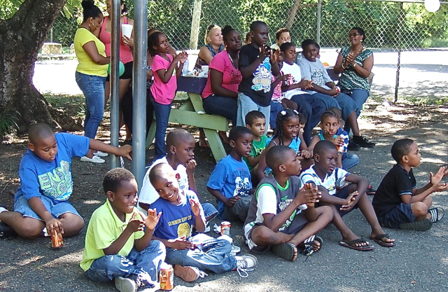Kids and parents share food and and a fun afternoon at the Frederiksted Boys and Girls Club.