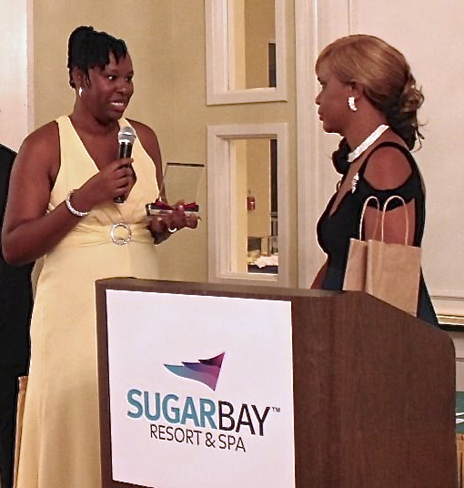 Miracle Babies president Cleone Boston, left, presents a plaque to honoree Siobhan King.