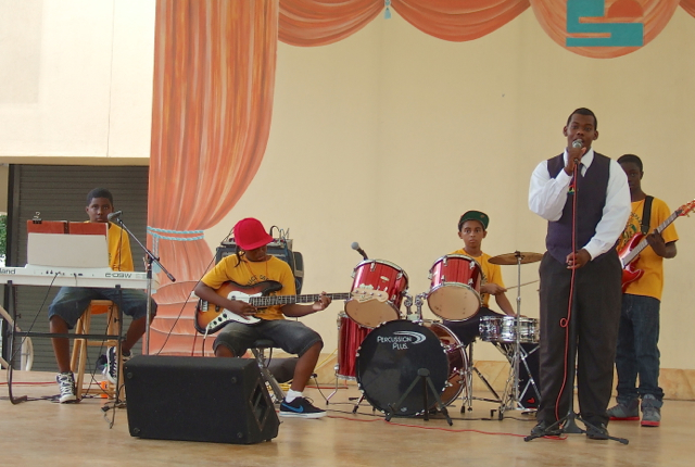 Five members of the Police Athletic League band perform.