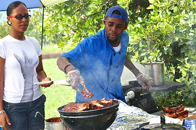 Jamal Miranda of Rum Runners grills up something special – alligator ribs.