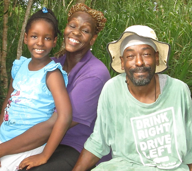 From left, volunteers Jade Rawlins, Ke-Ya Daniel and Dave Queeley at the St. John Community Foundation’s Community Garden.