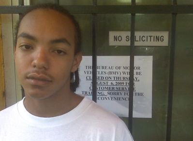 Terique Soldiew stands outside the Motor Vehicles office, where he was unable to get his driving permit.