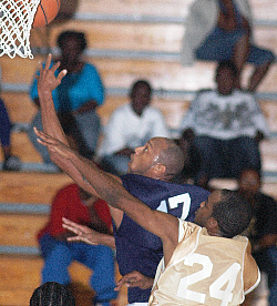 The Hoyas' Steven Hodge floats by the Lakers Shane Hodge for two of his game-high 22 points. 