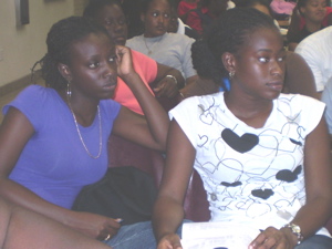 Caronique Cromwell, left, and Leima Lake listen to panelists at UVI.