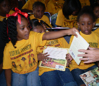 Campers are given their own books at the close of the summer reading camp.