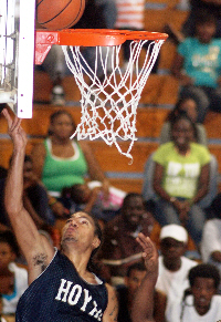 Hoyas point guard Ramon Castillo lays in two of his 23 points.