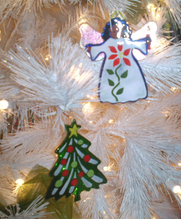 Glass ornaments by Jan Mitchell adorn a tree at Christmas Spoken Here. 