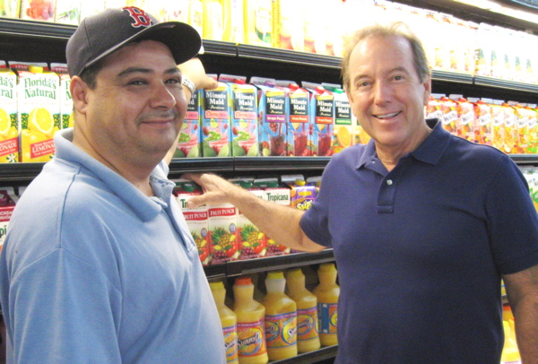 Manager Miguel Lopez, left, and owner Jim Overton in the St. John Gourmet Market.