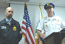 DEA agent Timothy T. Williams and V.I.Deputy Police Chief Christopher Howell at Friday's press conference.