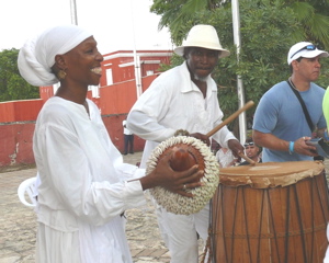 Dr. ChenziRa Davis Kahina and husband Carl Christopher play percussion near the Frederiksted pier.