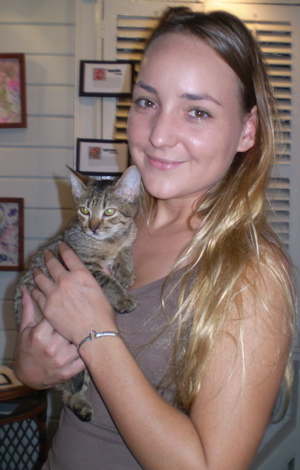 Animal Welfare Center vet Michelle  Mehalick holds one of the cats available for adoption at the center.