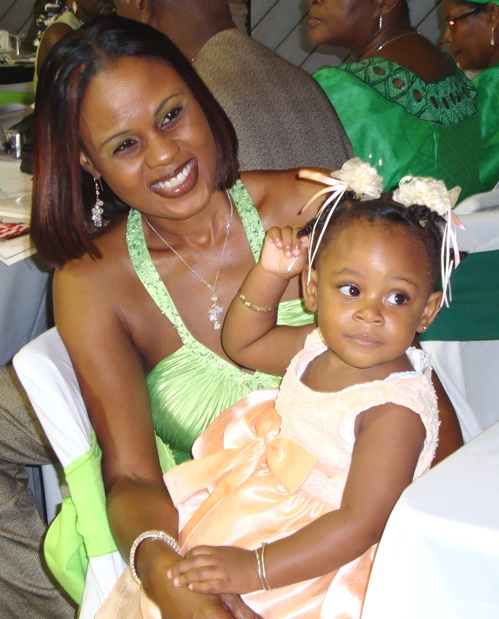 Yennasia Nugent, 1, takes in the heritage dancers ball with her aunt, Takiyah Antoine.