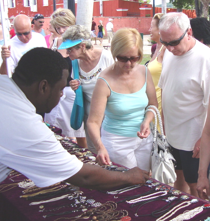 Michael and Maureen Knight check out jewelry, assisted by Kiente Matthews.