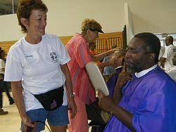 Fitzroy Smith (right) admires his new haircut and beard, courtesy of Theresa Morey.