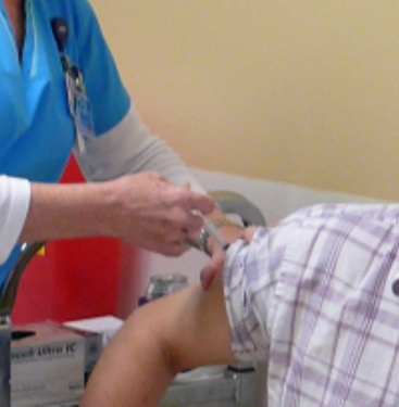 Administering the flu vaccine.