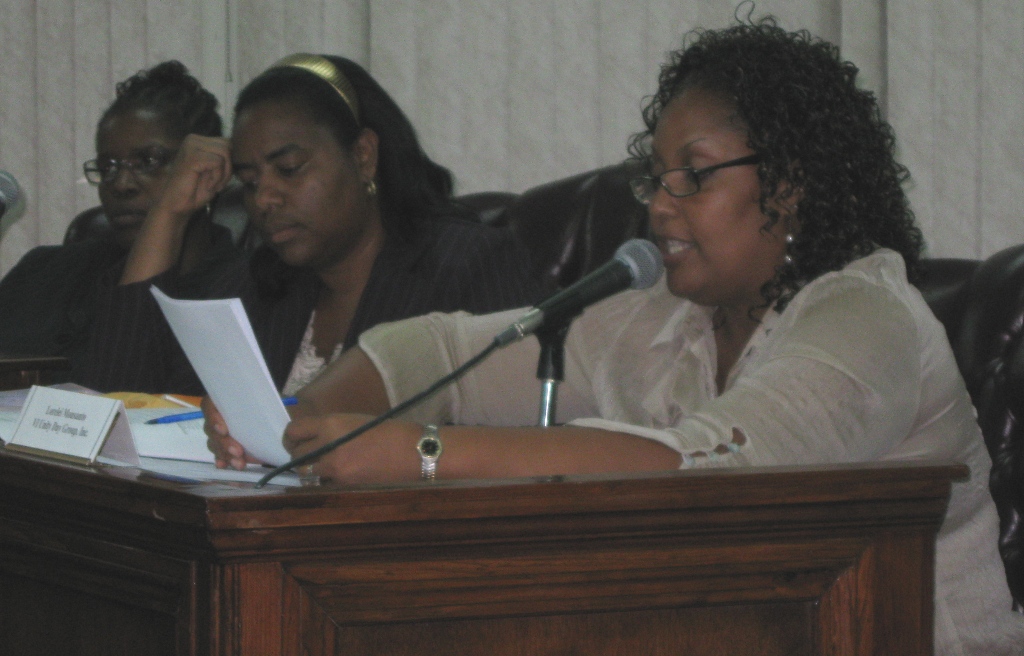 Unity Day Group President Lorelei Monsanto, right, makes a presentation to the PSC while members Stacie January, left, and Nydia Lewis listen.