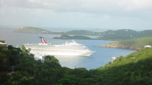 A cruise ship sails into St. Thomas. The VI Port Authority says it is owed more than $6 million in wharfage and tonnage fees paid by ships using the port.