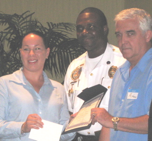 Photo is Police Department Detective Cassandra Vincent, Deputy Police Chief Darren Foy and V.I. Hotel and Tourism Association Chairman Richard Doumeng.