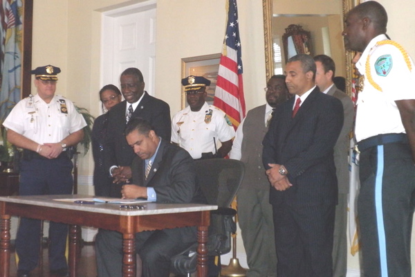 Gov. John P. deJongh Jr. signs Bill 28-11, elevating emergency preparedness to a cabinet level.