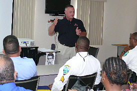 Instructor Doug Norwood talks leadership styles with police sergeants.