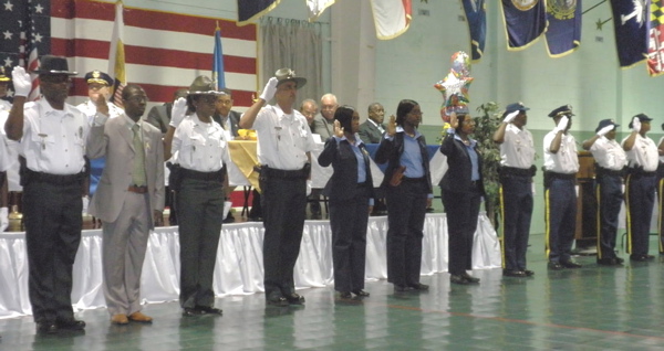 Members of the new class of police graduates take their oaths Thursday.