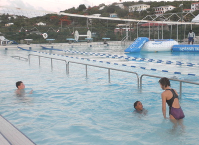 Lifeguard instructs young swimmers at St. Thomas Swim Association.