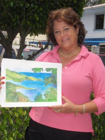 Brooks Brown with one of her vividly hued watercolors.