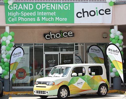 A 2010 Nissan Cube sits in front of the new Choice Commnication store.