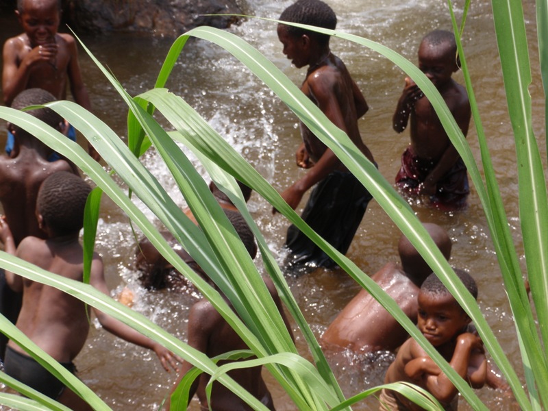 Swimmers in the Rwandan bush.