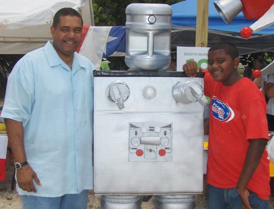 Gov. John deJongh Jr. and his son. Julian, with a robot at the chili festival.