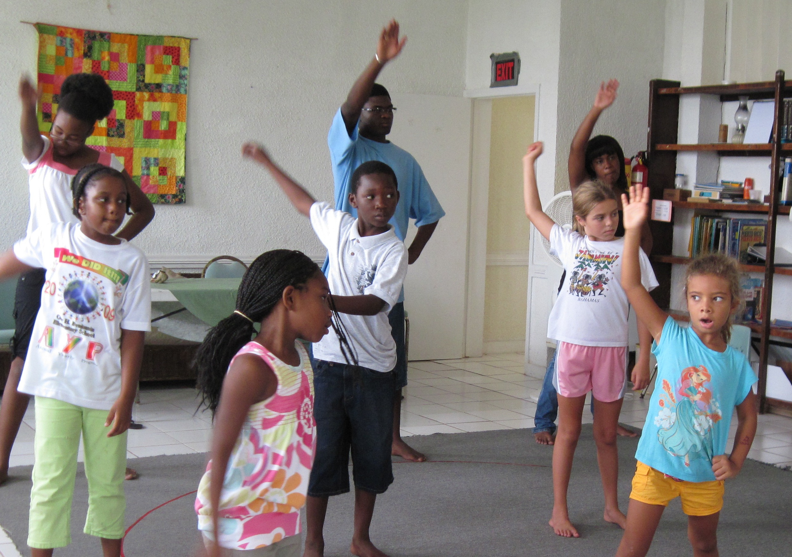 Children at the camp warming up before the kicks begin.