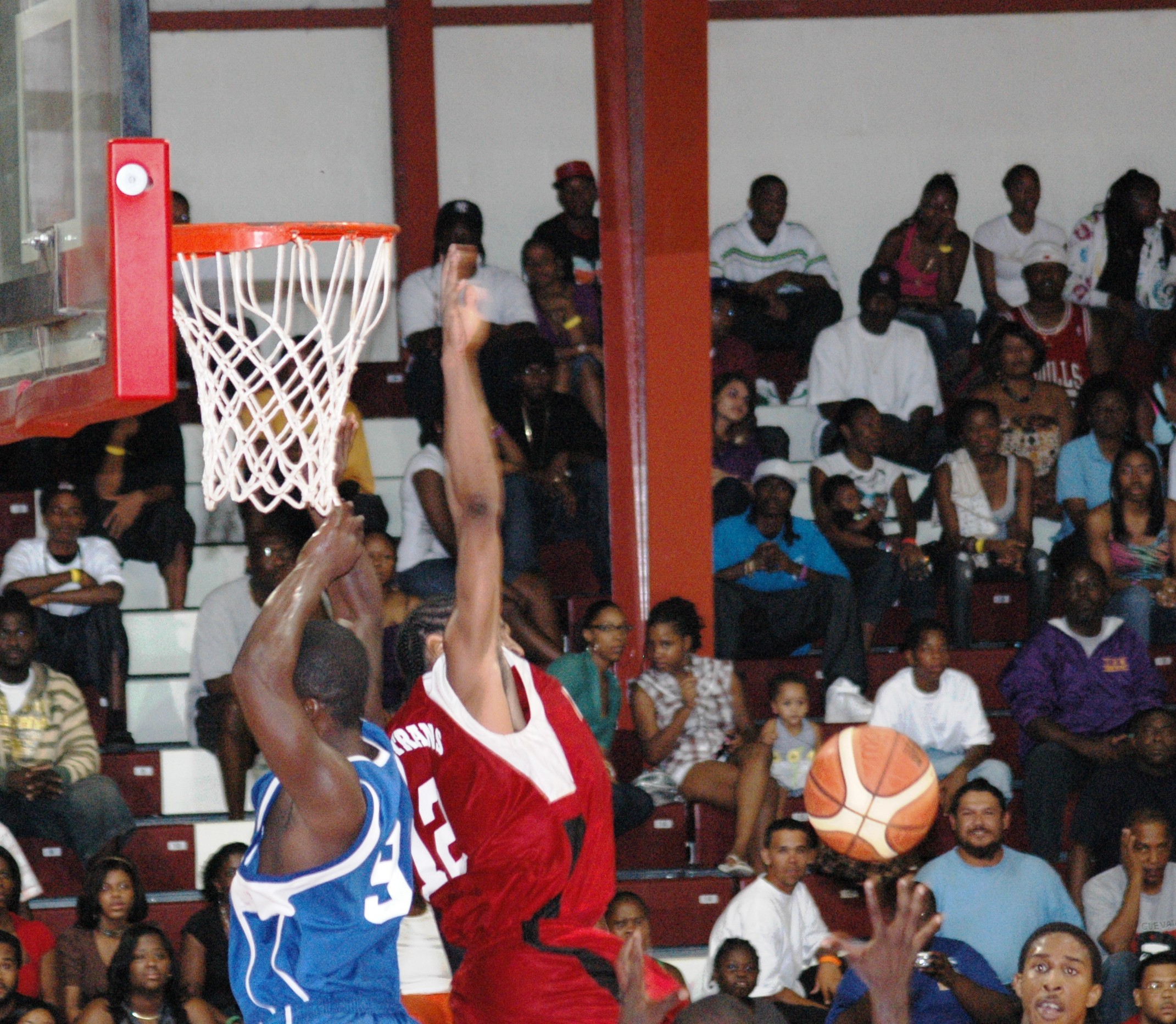 Boys Dem's Wilson Ferrance rejects a shot attempt by Eric McBean.