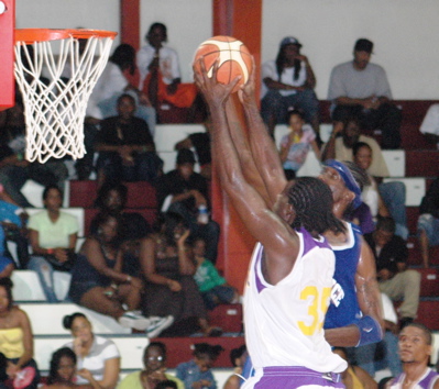 Guidance’s Jabahri Brown, in blue, bats away one of his seven blocked shots.