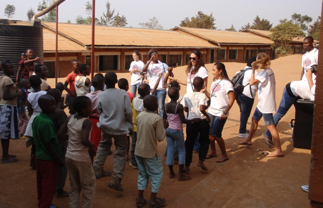 Young people from the U.S. Virgin Islands and Rwanda meet in a joyous, dusty dance.