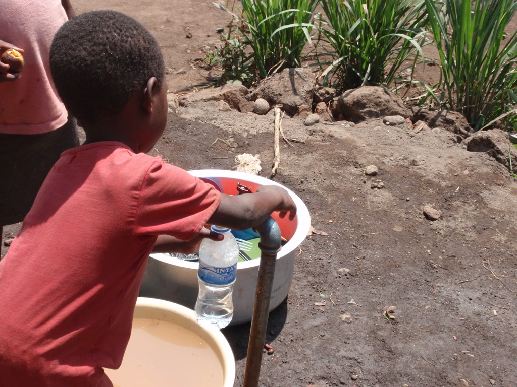 Water comes to the orphan center.