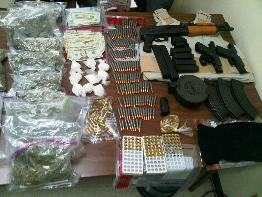 Items confiscated during Monday's searches included guns, ammo, cocaine, marijuana and even a bulletproof vest. (Photo courtesy VIPD)