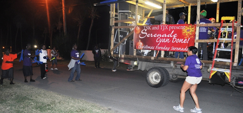 Sleepy neighbors and WTJX sponsors join the crowd in their pajamas as the band moves through Harbor View.