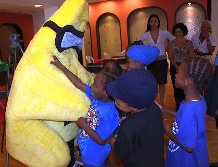 Tommy Star gets mobbed by youngsters at Thursday's Christmas party.