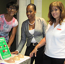 Fern LaBorde of the American Cancer Society, Shaniece Charlemagne, and Noemi Garcia-Taha of AARP.