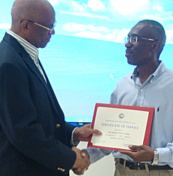 1st  Sgt. Dennis O. Dickie (right) accepts his award from Maj. General Renaldo Rivera.