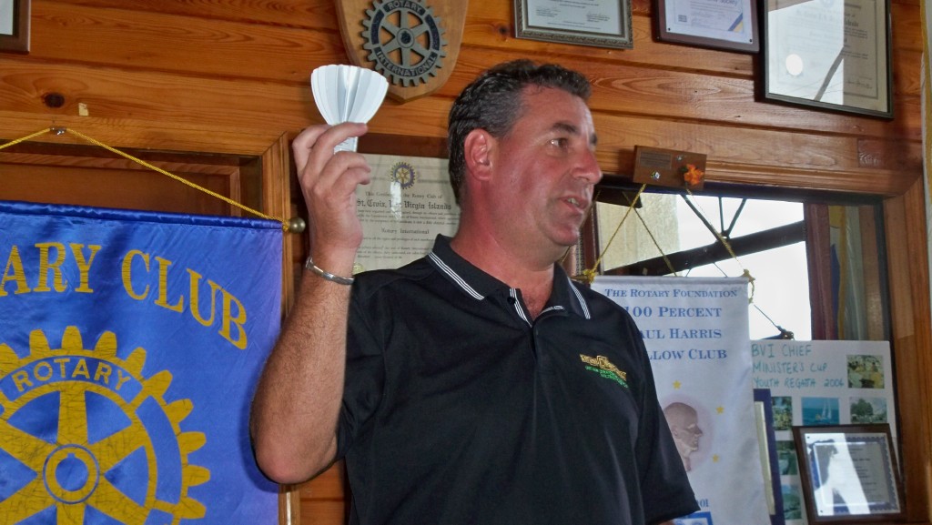 Mike Bruno, owner of Energy Wise Strategies, shows Rotarians an energy-saving LED bulb.