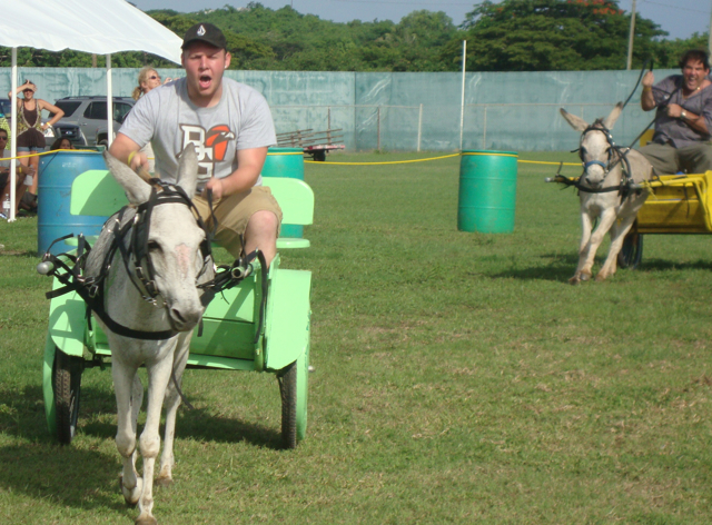 Cory Sturber, left, is driving for the finish but Joe Stropole and his donkey are charging hard on the inside.