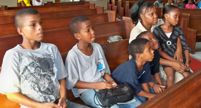 From left, Zaquan Almestica, Leocardio Guadalupe, Ojari Auguste, Omari Auguste, Nkeilla Auguste and Lorraine August listen to Saturday's gang presentation.