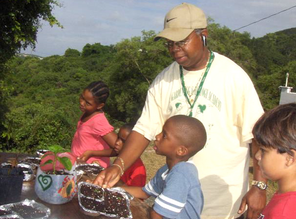 Director Mario Francis and youngsters look over their handiwork.