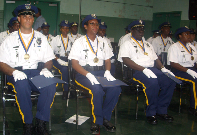 Police graduates sit straight and proud at the armory Friday.