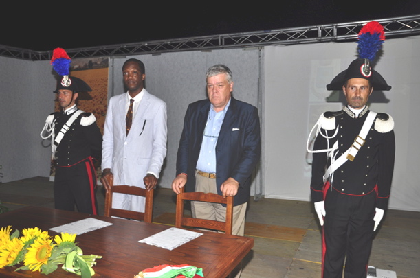 Pictured during the July 4 signing ceremony in Italy are Sen. Wayne James (inside left) and Mayor Aurelio Pellegrini, flanked by the Carabinieri (Italian military police).