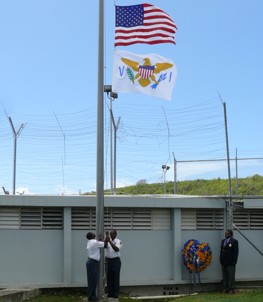 BOC officials paid homage to fallen corrections officer during a flag-raising ceremony Monday.