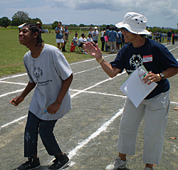 Dianne Chinnery (left) gets encouragement from Janice Lee, Special Olympics director.