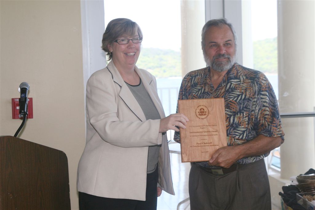 Environmentalist Paul Chakroff receives his EQA award from EPA Administrator  Judith Enck.